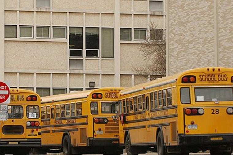 Buses line up at Lower Merion High School. Two years after spending $210 million to rebuild its two high schools, setting off a redistricting battle, the Lower Merion School District is looking at expanding the schools. (Inquirer file art)