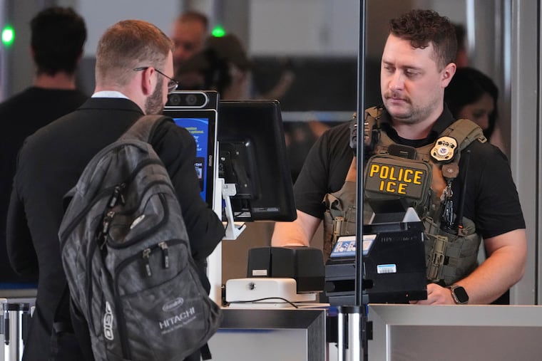 An ICE officer works at a TSA checkpoint at Pittsburgh International Airport in Imperial, Pa., on Thursday, March 26, 2026.