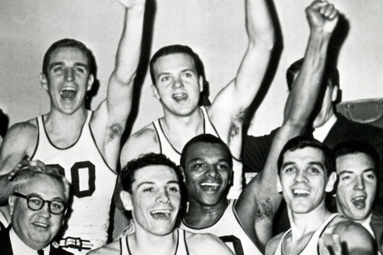 George Raveling (lower middle) celebrates with his coach Al Severance and his 1960 Wildcats teammates their victory over Detroit at Madison Square Garden that allowed them to advance to the NCAA quarterfinals.
