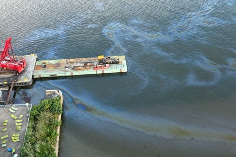 A sheen in front of Philadelphia's old Festival Pier on the Delaware River waterfront as seen from above on Tuesday.
