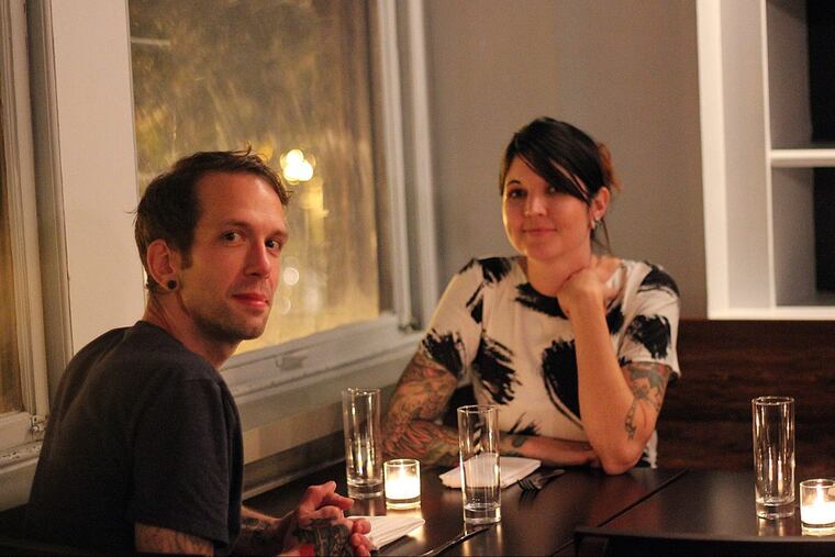 George and Jennifer Sabatino in the window of their restaurant, Aldine in October 2014.