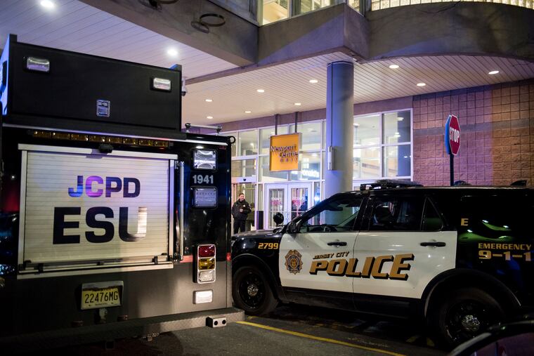 Police respond to a shooting at Newport Centre Mall in Jersey City, N.J., Friday, Jan. 11, 2019. (Reena Rose Sibayan/The Jersey Journal via AP)