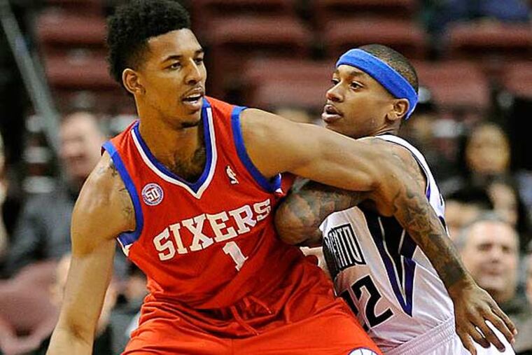 Philadelphia 76ers' Nick Young (1) drives past Sacramento Kings'
Issiah Thomas (22) during the first half of an NBA basketball game,
Friday, Feb. 1, 2013, in Philadelphia. The 76ers won 89-80. (Michael Perez/AP)