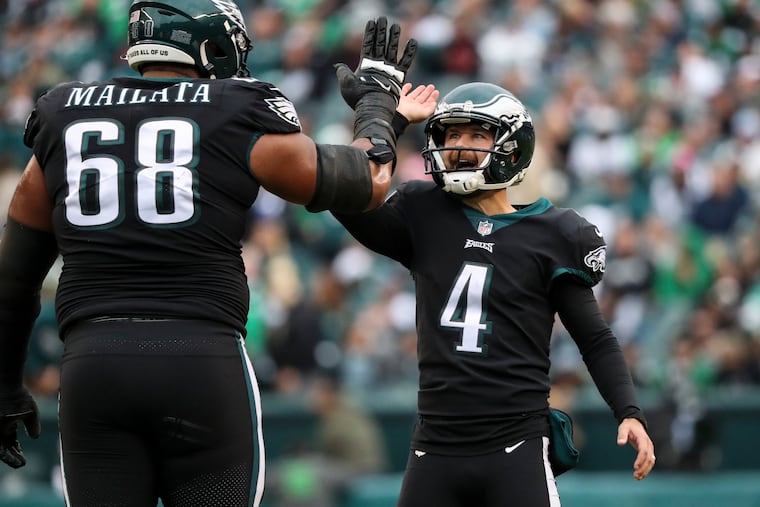 Eagles kicker Jake Elliott (4) celebrates with offensive tackle Jordan Mailata (68) after scoring against New Orleans in November.