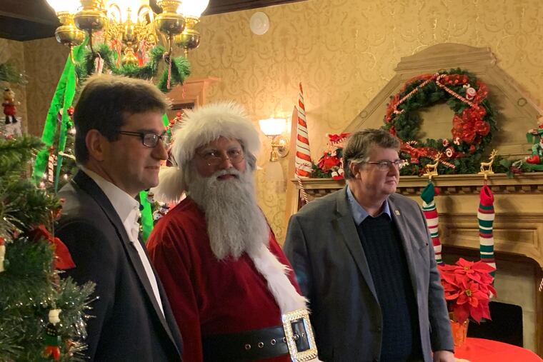 New Castle County Executive Matt Meyer (left) with Santa Claus and county councilman John Cartier at Rockwood Park and Museum earlier this month.