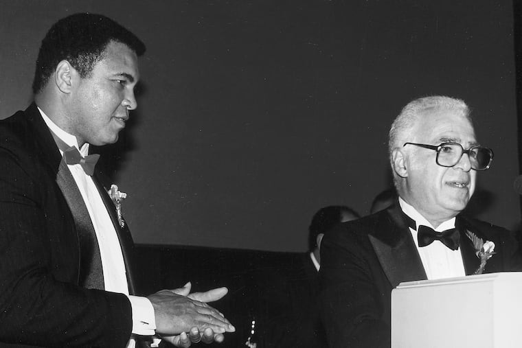 Stan Hochman (right) with Muhammad Ali, circa 1991.