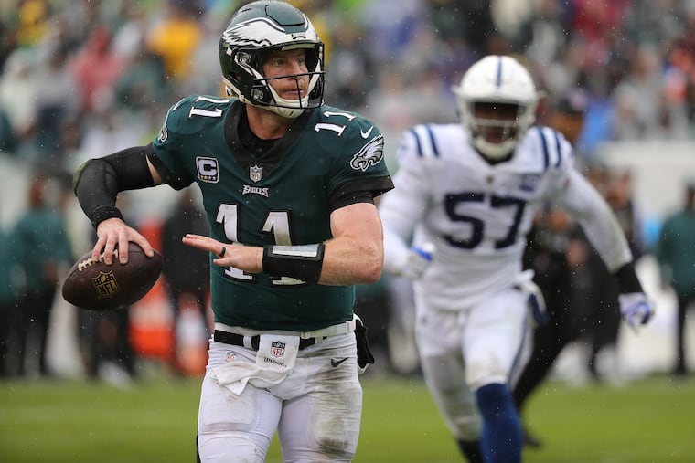 Eagles' Carson Wentz looks down field during the 2nd quarter as the Philadelphia Eagles play the Indianapolis Colts in Philadelphia, PA on September 23, 2018. DAVID MAIALETTI / Staff Photographer