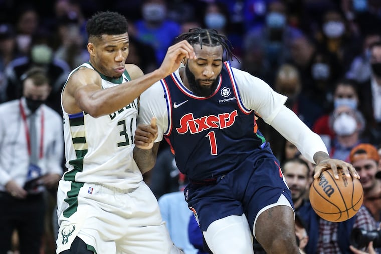 Sixers Andre Drummond drives on Bucks Giannis Antetokounmpo during the 2nd quarter at the Wells Fargo Center in Philadelphia, Tuesday.