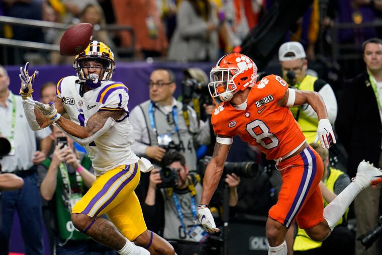 How far would LSU wide receiver Ja'Marr Chase, shown catching a touchdown pass against Clemson in the 2019 college football playoffs, have to fall for the Eagles to trade up for him?