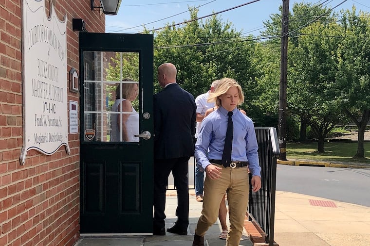 Kevin Baker Jr. (right) exits a magisterial district judge's office in Bristol after his preliminary hearing Wednesday. Baker is accused of hitting John Dugan with his pickup truck on Christmas Eve and fleeing the scene.