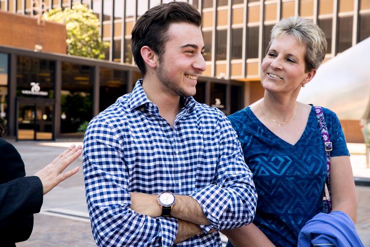 Aidan DeStefano, a transgender teen and recent graduate of Boyertown Area Senior High School, celebrates with his mother, Melissa DeStefano, after the U.S. Court of Appeals for the Third Circuit upheld the campus' policy allowing students like him to use bathrooms that conform to their gender identity.