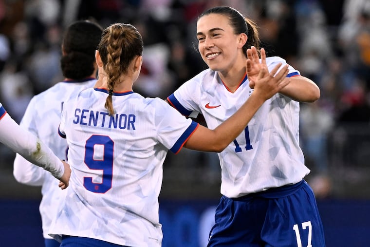 Sam Coffey (right) celebrates with teammates after scoring the goal that capped off the U.S.' win.