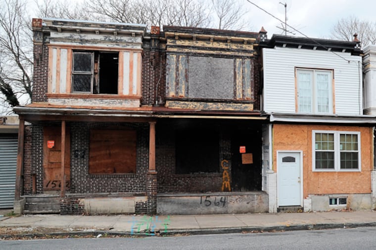 Houses in the 1500 block of Louis Street in Camden. Camden will try to demolish about 600 homes this coming year. (CLEM MURRAY/Staff Photographer)