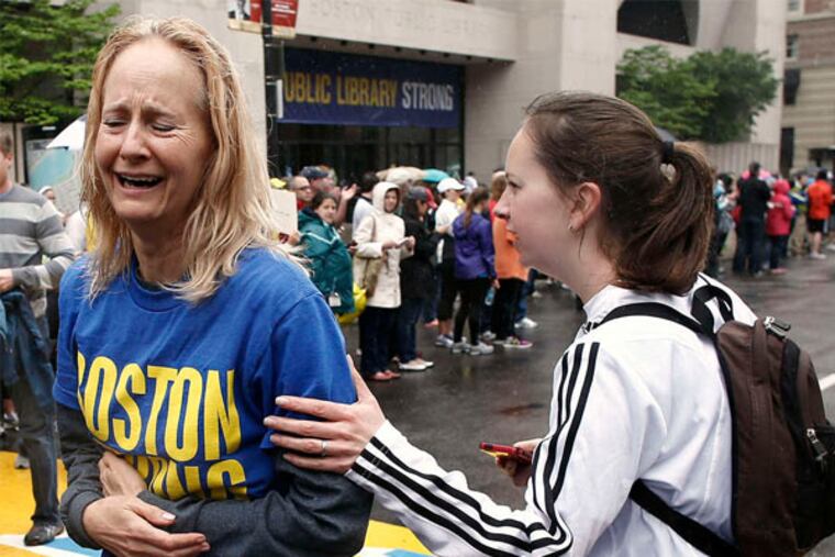 Pam Vingsness (right) comforts her mother, Rachel, of Newton, Mass., after they ran the last mile of the Boston Marathon route in a symbolic gesture for those who didn't finish last month.