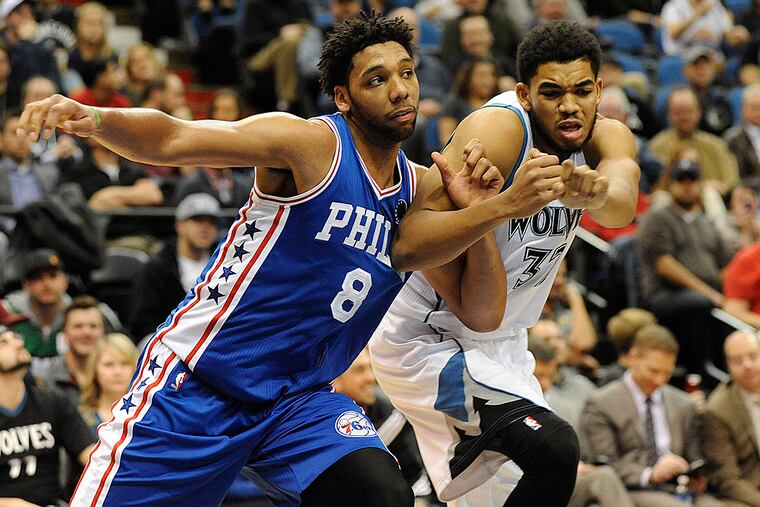 Philadelphia 76ers center Jahlil Okafor (8) boxes out against Minnesota Timberwolves center Karl-Anthony Towns (32) in the fourth quarter at Target Center. The Timberwolves win 100-95 over the 76ers.