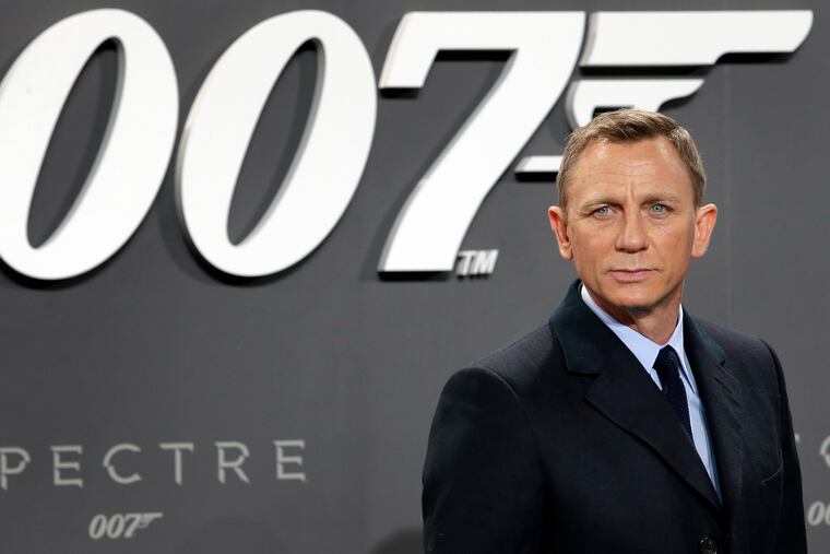 FILE - In this Oct. 28, 2015, file photo, actor Daniel Craig poses for the media as he arrives for the German premiere of the James Bond movie 'Spectre' in Berlin, Germany. (AP Photo/Michael Sohn, File)