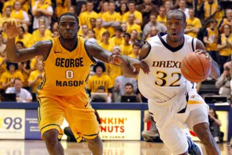 Drexel's Derrick Thomas dribbles the ball past George Mason's Bryon Allen. (Yong Kim/Staff Photographer)