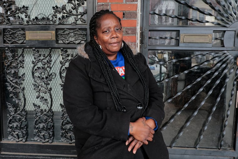 Kimberly Clark talks outside of her southwest Philadelphia home. She has to be out of her home of 24 years by April 1 and hopes she can receive housing assistance to find a new home she can afford.