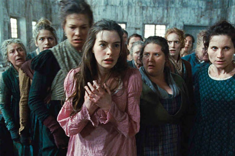 Anne Hathaway (center) stars as Fantine in "Les Miserables."