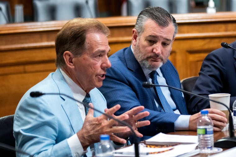Former University of Alabama head football coach Nick Saban (left) speaks as Sen. Ted Cruz (R., Texas) listens during a roundtable on the future of college athletics in March.