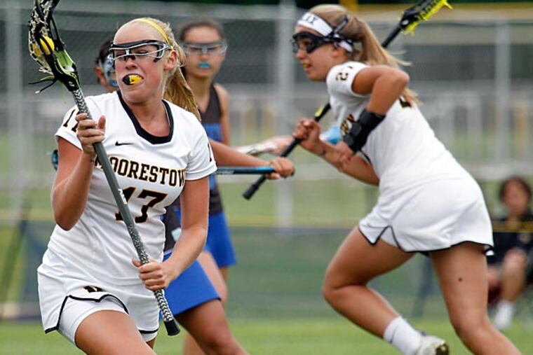 JMOOR30-- Moorestown HS Lauren Martinell is catching a ball during 1st
Half.
05-29-2014 ( AKIRA SUWA / Staff Photographer )
Game story off Princeton at Moorestown in SJ 3 final in girls'
lacrosse, 3:30 p.m.