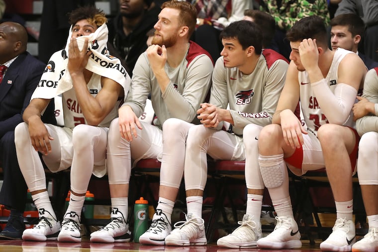 From left, Charlie Brown, Anthony Longpre, Pierfrancesco Oliva, and Taylor Funk of St. Joseph’s in the final minute of their 85-60 loss to George Mason on Jan. 3.