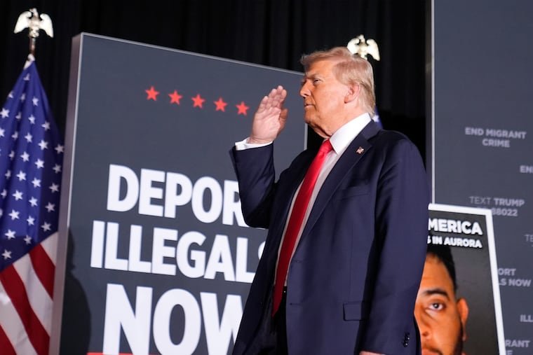 Republican presidential nominee former President Donald Trump salutes at a campaign rally at the Gaylord Rockies Resort and Convention Center on Friday in Aurora, Colo.
