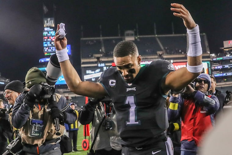 Eagles quarterback Jalen Hurts walks off the field following a win over the Giants at Lincoln Financial Field on Sunday.