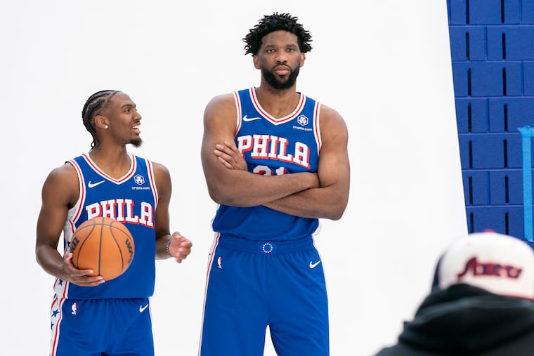 Tyrese Maxey (left) and Joel Embiid helped make a Drexel Hill couple's honeymoon in the Bahamas.
