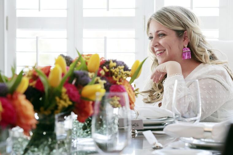Renee Patrone, founder of Party Host Helpers, at a friend’s home in Bryn Mawr, having set the table as if for a formal dinner party.