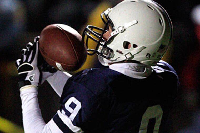 Shawnee's Alex Mourtos catches a touchdown pass with seconds left
on the clock. (David Swanson/Staff Photographer)