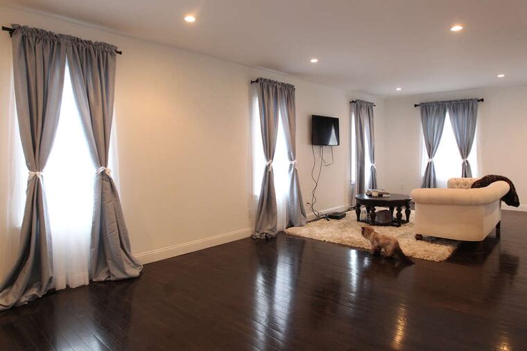 This living/dining room makes up the first floor of a house Woodend is renovating.