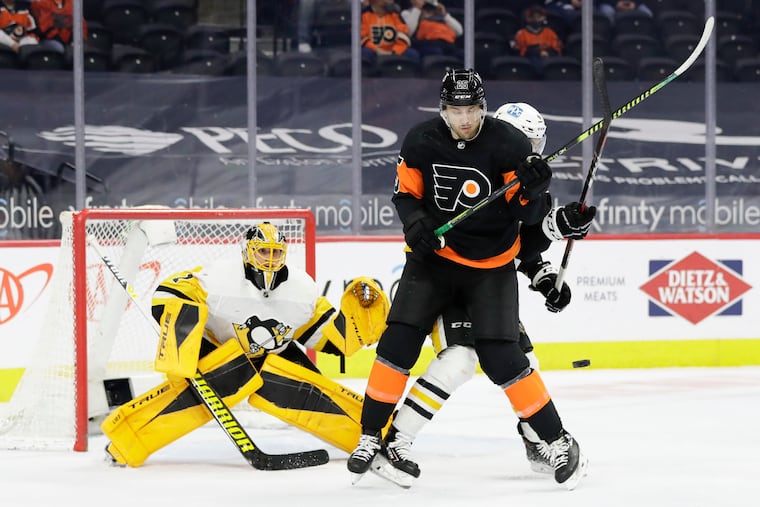 Flyers left winger James van Riemsdyk battles Penguins defenseman Cody Ceci as goaltender Casey DeSmith looks on during a game on May 3. Van Riemsdyk may be left unprotected in the expansion draft.