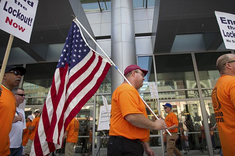 Members of the Metropolitan Regional Council of Carpenters hold a protest rally outside the Pennsylvania Convention Center protest at the entrance at N. Broad St. at Arch on Friday morning July 11, 2014. ( ALEJANDRO A. ALVAREZ / STAFF PHOTOGRAPHER )