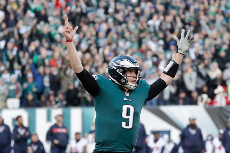 Nick Foles celebrates after throwing a fourth-quarter touchdown pass to Zach Ertz.
