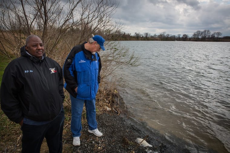 Avid anglers Rashawn Lewis, front left, and Fred Lentz, second from left, at the popular fishing spot known as DOD Ponds in Salem County, NJ. The secluded area is a popular fishing spot — and recently, gathering place for illegal drug users.