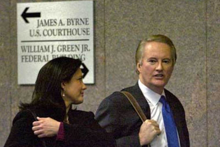Former CBS3 anchor Larry Mendte and his wife, Dawn Stensland, leave the federal courthouse after his sentencing on Monday. (John Costello / Staff Photographer)