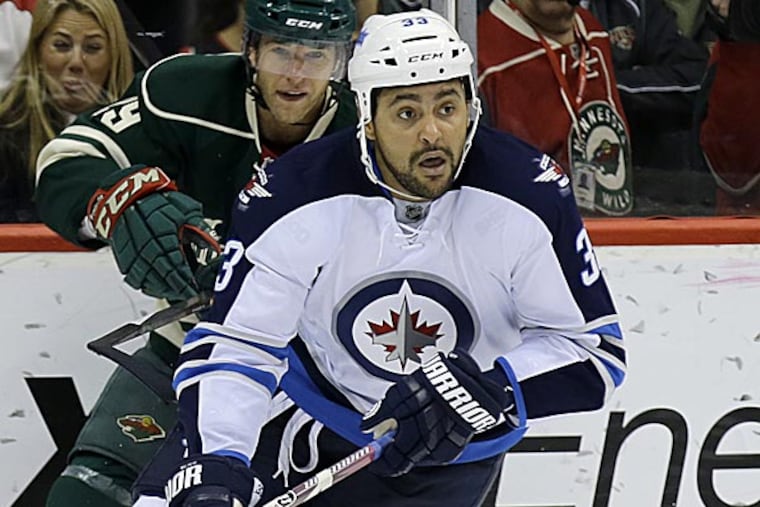 Jets defenseman Dustin Byfuglien. (Ann Heisenfelt/AP)