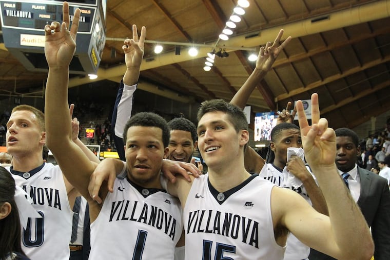 Jalen Brunson (second from left), Ryan Arcidiacono (right) and teammates celebrating a victory in November 2015.