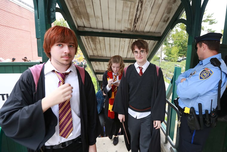 Arriving in Chestnut Hill via the Hogwarts Express are J.K. Rowling's famed characters (from left) Ron Weasley, played by John Spiewak; Hermione Granger, played by Mollie Dukin; and Harry Potter, played by Dan Lemoine. All are students at Chestnut Hill College.