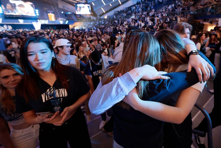 Sad Villanova fans react as the watch party ends at the Finneran Pavillion.