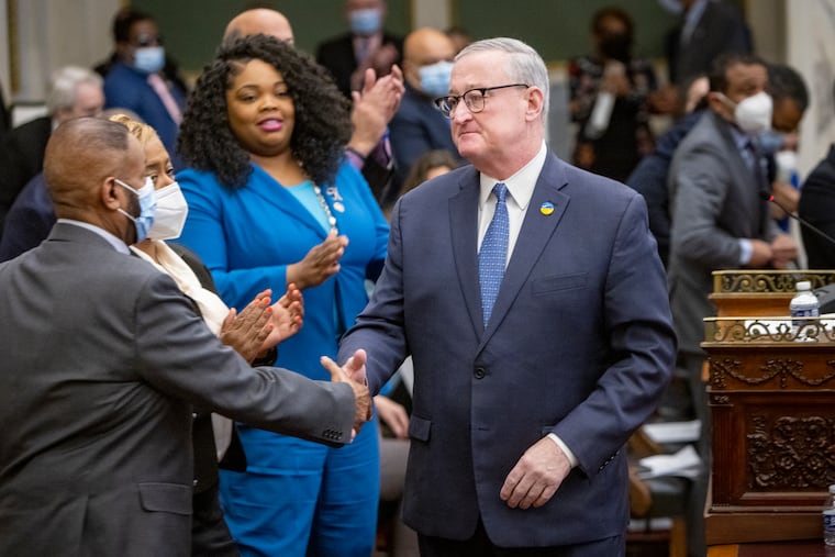 Philadelphia Mayor Jim Kenney (right) shakes hand of councilman Curtis Jones Jr. after giving budget proposal to City Council in chambers March 2, 2023.