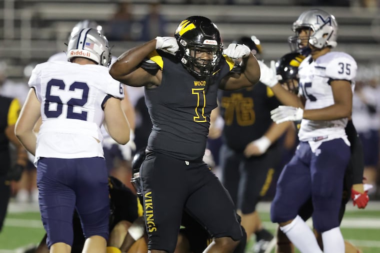 Archbishop Wood defensive end Eric Gardner flexes his muscles after a play against Malvern Prep on Sept. 9.