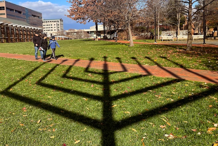 The large menorah erected by the American Friends of Lubavitch in Independence Mall casts a wide shadow. The eight days of Hanukkah began at sunset Sunday evening. A menorah was first lighted in front of Independence Hall in 1974.