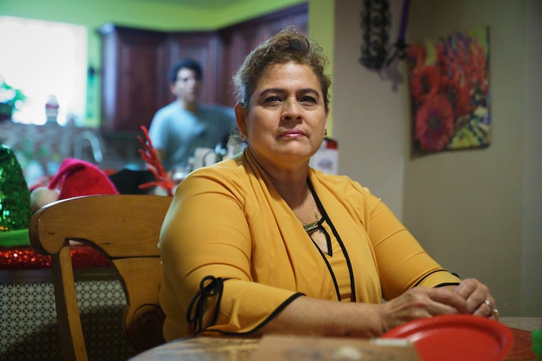Maria Del Carmen Diaz, a professional house cleaner, shown here in her home near Girard College in Philadelphia, Monday, December 31, 2018.