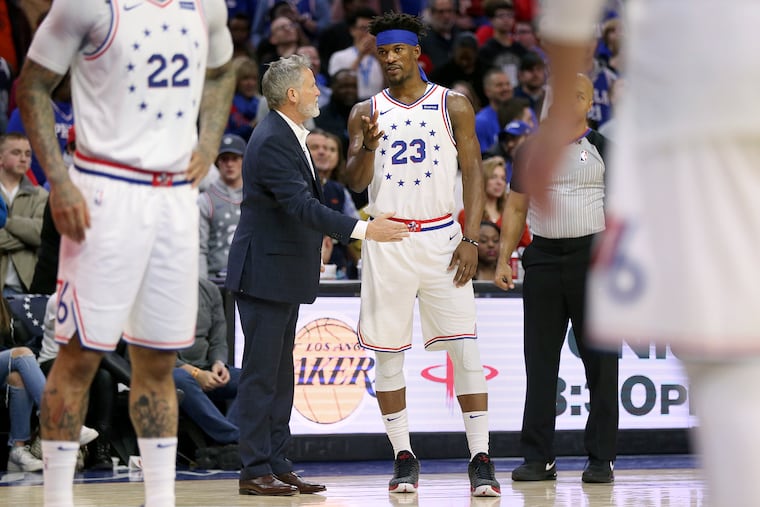 Sixers head coach Brett Brown talks to Jimmy Butler (23) during a game against the Oklahoma City Thunder at the Wells Fargo Center in South Philadelphia on Saturday, Jan. 19, 2019. The Sixers lost 117-115.