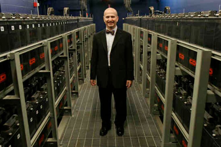 SunGard Data Systems CEO Cristobal Conde stands near backup batteries at a company site at 401 N. Broad St.