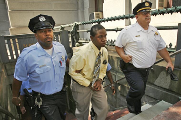 Sheriff’s deputies on Tuesday escort defendant Kinta Stanton from the 13th Street subway station, where Sean Patrick Conroy was beaten last year. Stanton reenacted the beating in court today. (Alejandro A. Alvarez / Staff Photographer)