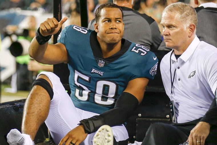Eagles middle linebacker Jordan Hicks is driven of the field after an injury during matchup against the Washington Redskins at Lincoln Financial Field, Monday, October 23, 2017.