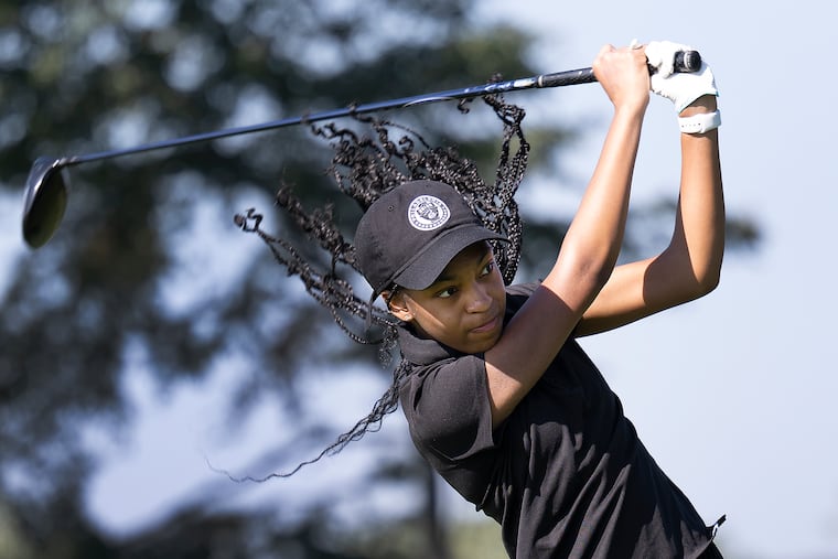 Zoey Smith plays golf on Tuesday during the PIAA District XII Gold Championship at Philmont Country Club in Philadelphia. Smith first picked up a golf club when she was 4, but she lost interest in golf for a long time, and didn't play as a freshman at SLA Beeber, a city magnet high school. She decided to pick up her clubs again this year, and quickly became the Public League girls' champion.
